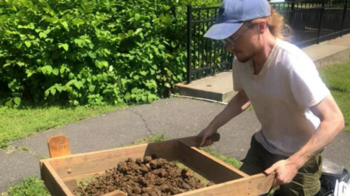 Harvard Researcher Eric Johnson sifts dirt excavated at a site, searching for remnants of production debris from Campbell’s Wampum Mill, which existed near the Electric Lake area.