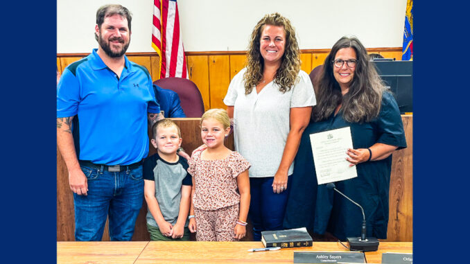 Ashley Sayers, backed by her husband, Everett, and their son and daughter, and Emerson mayor Danielle DiPaola (at right), is the newest member of the Borough Council, sworn Aug. 13, 2024. Courtesy photo