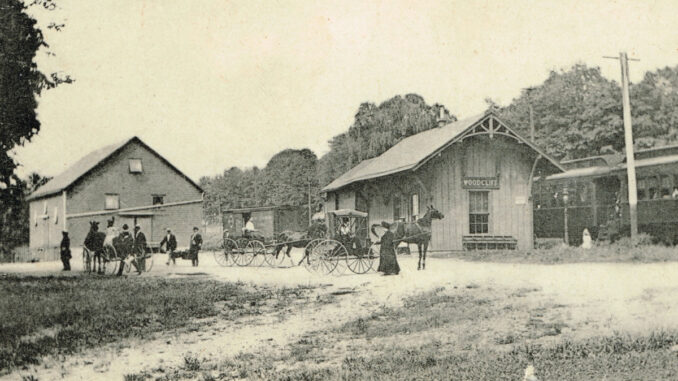 Dated to around 1900, this photograph captures a scene outside the Woodcliff railroad station in an era before automobiles. A sign on the depot reads Woodcliff, placing this before 1910 when Lake was added to the name. The change reflected the borough's new man-made reservoir.