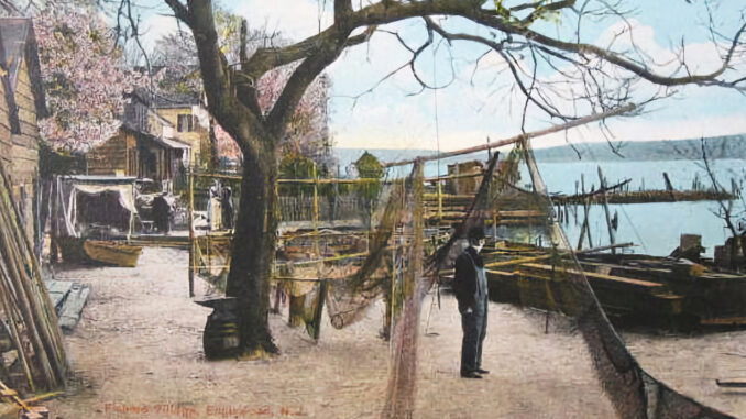 Capt. Charles Von Wagoner dries fishing nets in Fisherman’s Village, part of the Undercliff settlement.