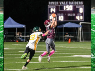 Senior River Vale Raider DB, Tyler Hurst (#38) leaps in front of his receiver to pick off a pass and put the game away.