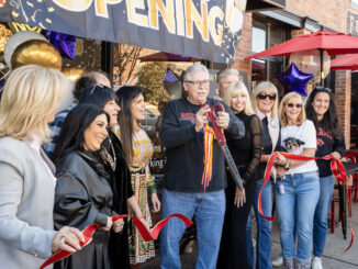 Westwood Mayor Ray Arroyo cuts a ribbon at Five Corners downtown, in a grand re-opening ceremony, on Oct. 19, 2024. Richard Frant/FrantVisuals