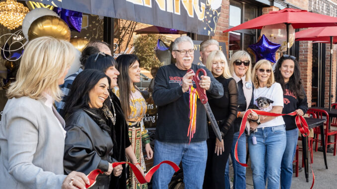 Westwood Mayor Ray Arroyo cuts a ribbon at Five Corners downtown, in a grand re-opening ceremony, on Oct. 19, 2024. Richard Frant/FrantVisuals