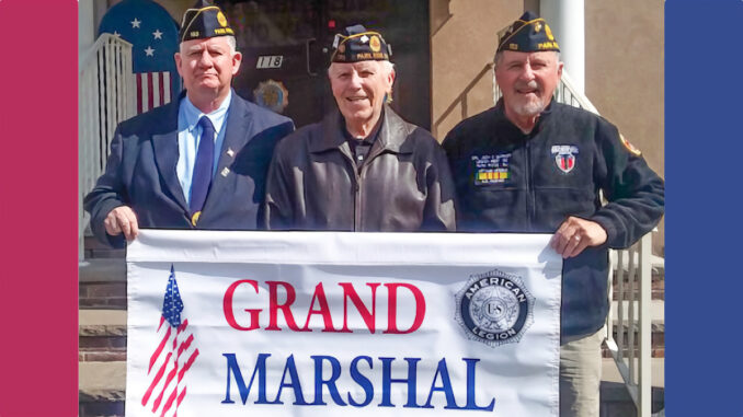 Commander Joseph Collery, left, of the Cpl. Jedh C. Barker Memorial Post 153 American Legion announces that he has named Park Ridge resident Dick Bozzone, center, to be the grand marshal of the 2019 Tri-Boro Memorial Day Parade. At right: Parade chair Jim Miller. File