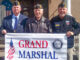 Commander Joseph Collery, left, of the Cpl. Jedh C. Barker Memorial Post 153 American Legion announces that he has named Park Ridge resident Dick Bozzone, center, to be the grand marshal of the 2019 Tri-Boro Memorial Day Parade. At right: Parade chair Jim Miller. File