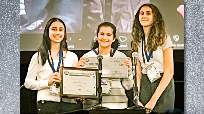 Maya Faehndrich, Ayana Mehta, and Sophia Saroufeem of Demarest Middle School proudly display their award for securing second place in the prestigious NJSBA STEAM Tank Challenge, guided by their teacher Ms. Joanne Werner.