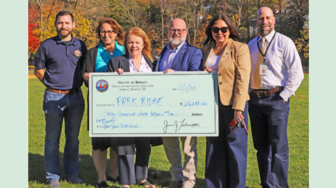 cting parks director Craig Dorsett, Commissioner Tracy Silna Zur, Commissioner Mary Amoroso, Park Ridge Mayor Keith Misciagna, Commissioner Chairwoman Germaine Ortiz, and Open Space Trust Fund Executive Director Ken Aloisio. Via Derek Sands for Bergen County.