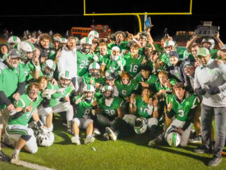 The Pascack Valley football team and coaches celebrate the retaining of the Rumble for the Rail title as well as the Sectional State Championship. Mike Smith photo.