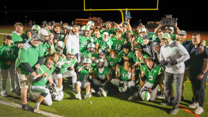 The Pascack Valley football team and coaches celebrate the retaining of the Rumble for the Rail title as well as the Sectional State Championship. Mike Smith photo.