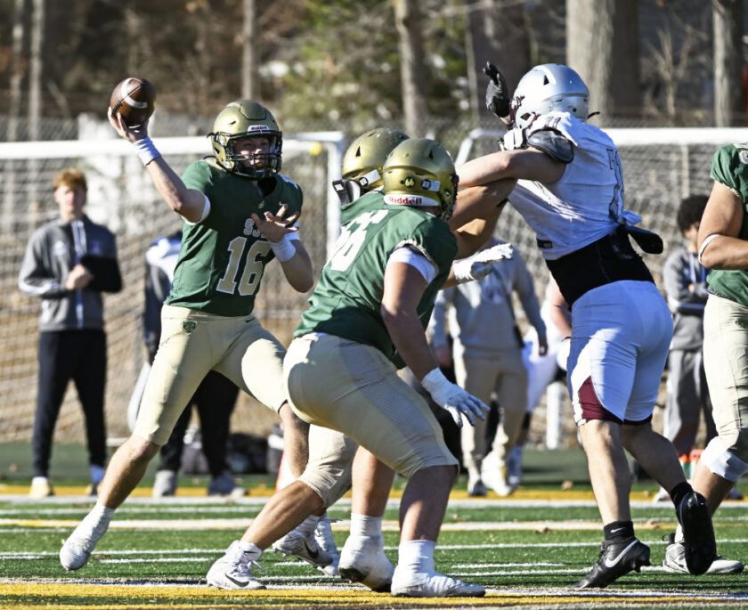 Green Knights QB Mason Geis (#16) winds up for a pass in the pocket. Paul R. Sullivan photo