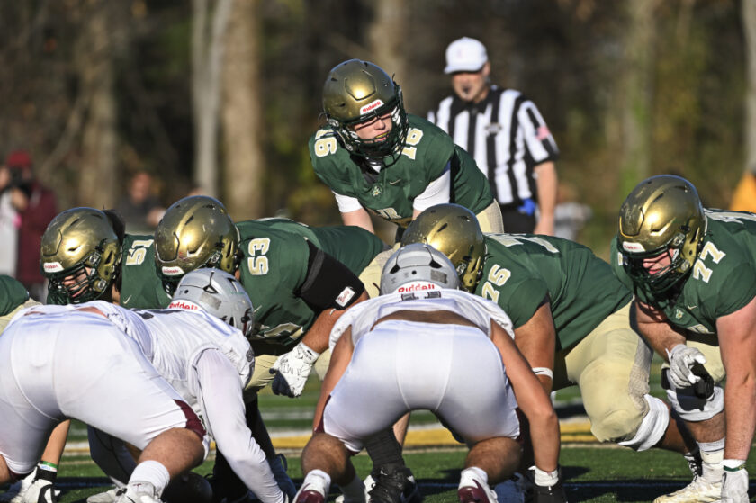 Quarterback Mason Geis (#16) takes his position behind center for the Green Knights. Paul R. Sullivan photo