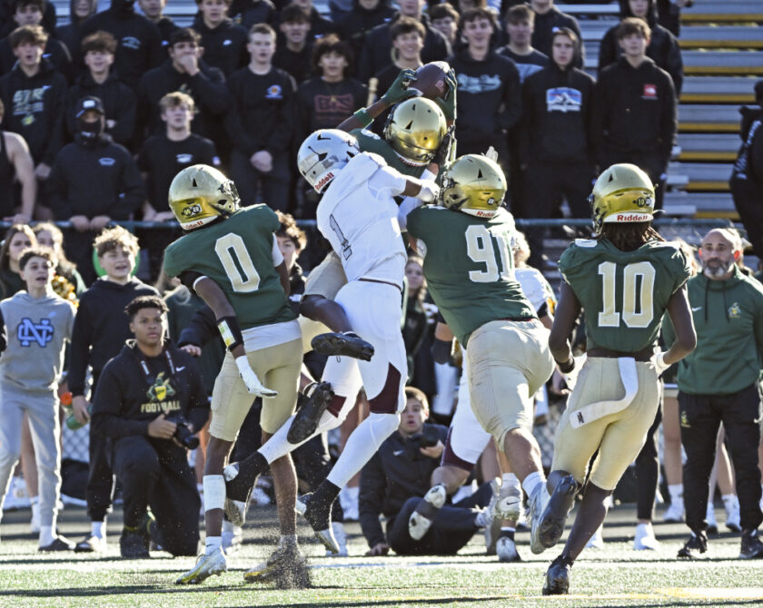 Travon Chardonet (#6), cornerback for St. Joseph Regional, snags an interception along the sideline during the second quarter. Paul R. Sullivan photo