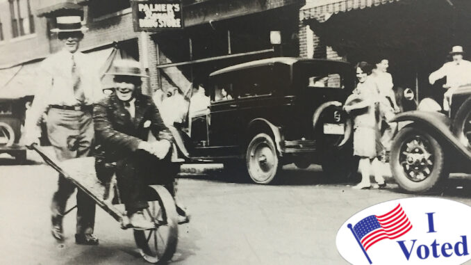 The perils of political prognostication. Spectators on Westwood Avenue in 1929 help give former Mayor Harry Goodwin, wheeling reporter Don Dutcher, a dose of good-natured comeuppance.