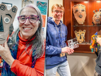 Suzi Gerace showcases her clay mask adorned with laser-cut plastic earrings, created using the Hillsdale Library’s resources, alongside Hillsdale Free Public Library Director David Franz at the January mixed media art exhibit featuring four local artists at the Hillsdale Free Public Library.