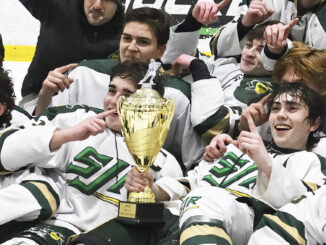 St. Joseph Regional H.S. Green Knights hockey team take their due as Bergen County hockey champs, Jan. 22 in Wayne. Detail of photo by Paul R. Sullivan.