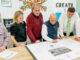 New Hillsdale Public Schools trustee Kathleen Puerta joins, from left to right, Michael Kenduck, Salvatore Sileo, Justin Saxon, and Kevin Donatello in looking over George White school overhaul plans on Feb. 10. Photo: Mike Olohan.