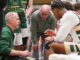 Green Knights Basketball Head Coach (Dan Davis) goes over the final play during a TO. Paul R. Sullivan photo.