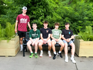 Way to go! Dylan Minneker, Ciaran Henry, Tyler Minneker, Ben Gulleyan, and Evan Minneker show off part of the planter box project Tyler led at HFPL. Courtesy photo.