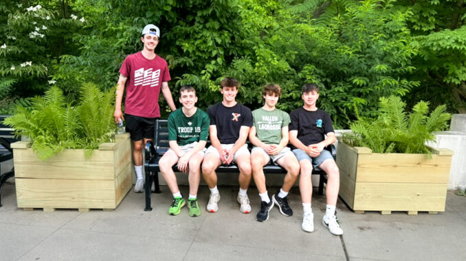 Way to go! Dylan Minneker, Ciaran Henry, Tyler Minneker, Ben Gulleyan, and Evan Minneker show off part of the planter box project Tyler led at HFPL. Courtesy photo.