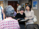 Annie Fan, center, was one of many to answer the cal this year at the Hillsdale Access For All Fifth Annual Art Show For People With Disabilities. The reception was May 1 at Hillsdale Free Public Library, where the exhibition will run throughout May. John Snyder photo.