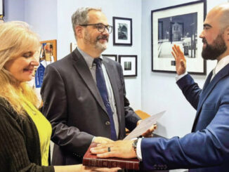 ‘Under the authority of the people…’ Borough clerk Denise Kohan facilitates, and Mayor Michael Sheinfield officiates, swearing in Travis Woods as Hillsdale’s new police chief on Tuesday, May 13. Borough of Hillsdale photo.