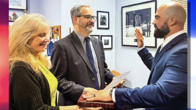 Woods ‘Under the authority of the people…’ Borough clerk Denise Kohan facilitates, and Mayor Michael Sheinfield officiates, swearing in Travis Woods as Hillsdale’s new police chief on Tuesday, May 13. Borough of Hillsdale photo.