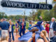 Woodcliff Lake Mayor Carlos Rendo applauds as the name of the borough’s new park is officially revealed on Saturday, May 3. It is the borough’s first and only municipally owned park. Photo by Mike Olohan