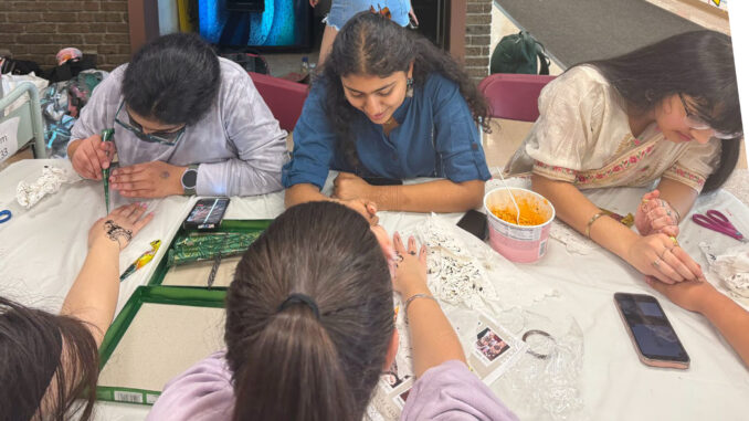 World Culture Day 4 Henna tattoos are popular at Pascack Hills High School’s Third Annual Celebration of Cultures, held May 2. Maya Zislin photo.