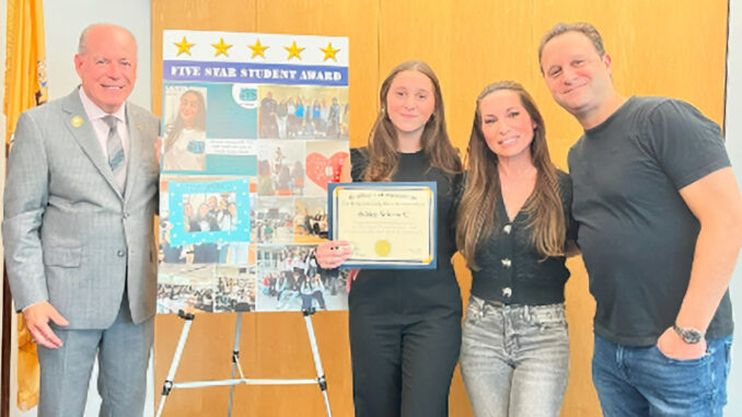 Way to go! Bergen County Clerk John S. Hogan presents the Five-Star Student Award to Ashley Schwartz of Pascack Hills High School, here with her parents. Photo sent by John Hogan’s office.
