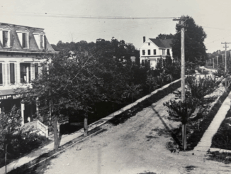 This view up Park Avenue toward Kinderkamack Road dates to the 1890s. Broadway branches to the right. On the left is a hotel—one of three in Park Ridge, when summers drew city vacationers. The road had not yet been paved, but plank sidewalks are placed thanks to the efforts of the Park Ridge Improvement Association.