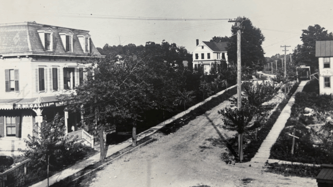 This view up Park Avenue toward Kinderkamack Road dates to the 1890s. Broadway branches to the right. On the left is a hotel—one of three in Park Ridge, when summers drew city vacationers. The road had not yet been paved, but plank sidewalks are placed thanks to the efforts of the Park Ridge Improvement Association.