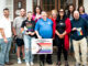 Among those powering the Third Annual Westwood Pride Celebration June 1: Chris Doran; Chris Haffler; Mackenzie Fox; county commissioners Germaine Ortiz, Tom Sullivan, and Mary Amoroso; Ann-Marie Jonas; Casey Bontemps; Bob Dzienis; and Lisa Bontemps. John Snyder photo set against the Intersex-Inclusive Progress Pride Flag.