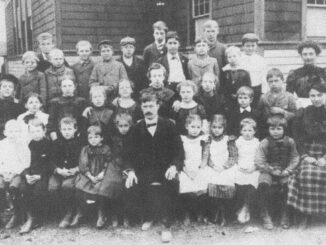 Old Tappan's two-room schoolhouse, along with teachers, principal, and the student body, in 1900.