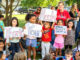 Brookside school’s student body and PTO turn out on Sept. 12, to cheer Noah Perez’s ribbon cutting for the school’s outdoor classroom and reading area. Perez, who graduated Brookside and is now a Cardinal football player, singer, and actor, told the hundreds gathered, “I’ve always loved reading. To combine that with Scouting—it means a lot to me.” John Snyder photo.
