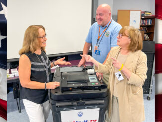 Township Clerk Sue Witkowski talks with Bergen County elections officials Debra Francica and Wes Wagner following their Sept. 24 presentation to residents on the upcoming Nov. 4 General Election, which includes the statewide race for governor. Mike Olohan photo.