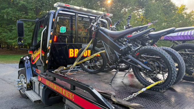 WWPD impound, posted Sept. 3, 2025 A row of dirt-bike–style electric motorcycles sits strapped to a flatbed after being impounded by Westwood police on Sept. 3. The department says throttle-only models without pedals require registration, insurance, and a licensed operator. (Courtesy Westwood Police Department)
