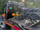 A row of dirt-bike–style electric motorcycles sits strapped to a flatbed after being impounded by Westwood police on Sept. 3. The department says throttle-only models without pedals require registration, insurance, and a licensed operator. (Courtesy Westwood Police Department)