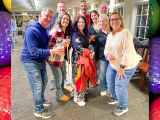 Several of the more than 140 people who turned out for the library’s Oct. 10 Mini Golf “Fun”Raiser — a nine-hole course that wound through the upper floors and raised more than $9,000 for the library’s mission. Ashok Ginde photo.