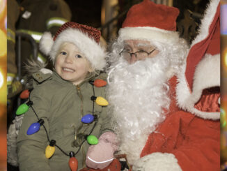 There’s one star of the show at Westwood’s annual Home for the Holidays parade—Santa Claus, who delighted kids in 2019 by noting their wish lists. | Photo by Danielle O'Brien