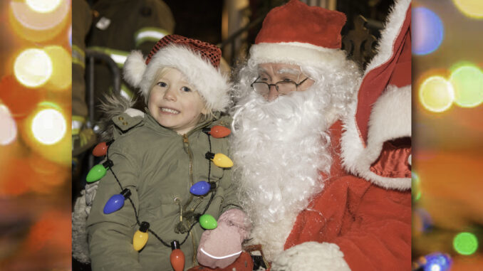 Home For the Holidays Santa and friend There’s one star of the show at Westwood’s annual Home for the Holidays parade—Santa Claus, who delighted kids in 2019 by noting their wish lists. | Photo by Danielle O'Brien
