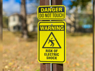 All 10 light poles at the Township of Washington’s Memorial Field now carry permanent warning signs. Michael Olohan photo.