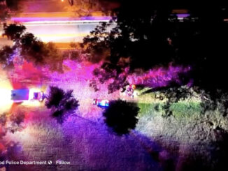 Drone footage released by Westwood Police shows emergency vehicles responding on the night of Oct. 15. The colorful illumination comes from patrol lights, not infrared imaging. Screenshot, Westwood Police video.