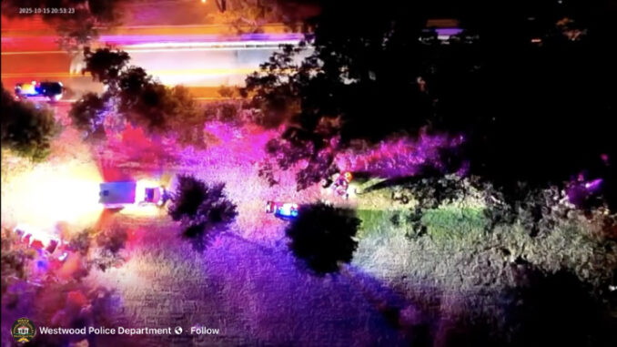 WW drone video Drone footage released by Westwood Police shows emergency vehicles responding on the night of Oct. 15. The colorful illumination comes from patrol lights, not infrared imaging. Screenshot, Westwood Police video.