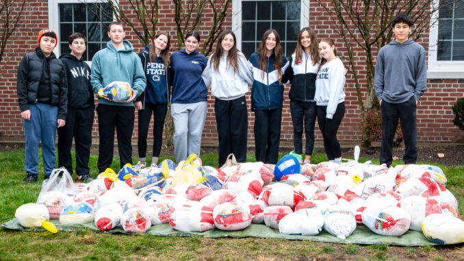 More than 300 turkeys were collected at the 33rd Annual Helping Hand Food Pantry Turkey Drive, thanks in part to student volunteers who helped unload and sort donations on Saturday, Nov. 22, 2025. John Snyder photo.