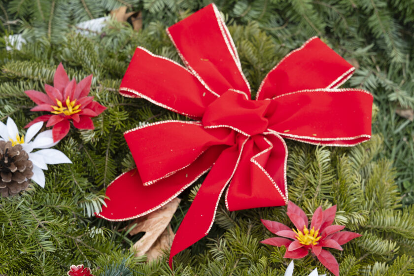 Doris Zaconie decorated the WTFD's Christmas wreaths, for sale at the annual tree sale at Memorial Field. John Snyder photo.