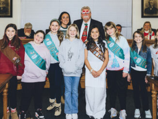 Backed by seasonally attired Westwood Mayor Ray Arroyo and land use liaison Lauren Letizia, fifth-graders from Berkeley and Brookside Elementary schools stood out at the Dec. 16 meeting of the governing body. They are Lainey Joy, Seraphina, Isabella, Victoria, Hayden, Siena, Toby, and Rebecca. John Snyder photo.