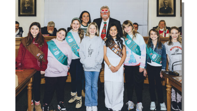 Backed by seasonally attired Westwood Mayor Ray Arroyo and land use liaison Lauren Letizia, fifth-graders from Berkeley and Brookside Elementary schools stood out at the Dec. 16 meeting of the governing body. They are Lainey Joy, Seraphina, Isabella, Victoria, Hayden, Siena, Toby, and Rebecca. John Snyder photo.