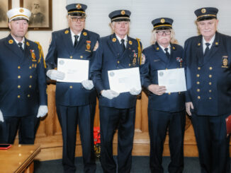 Westwood Volunteer Fire Department Chief Brian Kronewitter; 50-year members Daniel O’Brien, JayMee Hodges, and William Quinn; and Pat Conner, president of the New Jersey–New York Volunteer Fire Association, at Borough Hall on Dec. 16. John Snyder photo