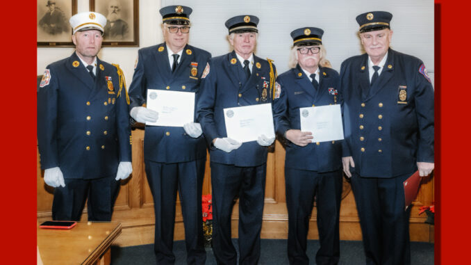 Westwood Volunteer Fire Department Chief Brian Kronewitter; 50-year members Daniel O’Brien, JayMee Hodges, and William Quinn; and Pat Conner, president of the New Jersey–New York Volunteer Fire Association, at Borough Hall on Dec. 16. John Snyder photo