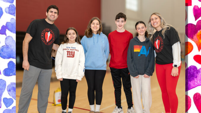 TOP FUNDRAISERS: Flanked by Westwood Regional Middle School physical education teachers Anthony Orsini and Elyssa Wottring are the school’s top student fundraisers for the American Heart Challenge, culminating in activities Feb. 18. Left to right are Ryleigh Fitzpatrick (6th grade), Maeve Fitzpatrick (7th grade), Nicholas “Nick” DeTore (8th grade), and Caroline Fennell (8th grade). The event raised at least $6,600 for the American Heart Association. John Snyder photo.
